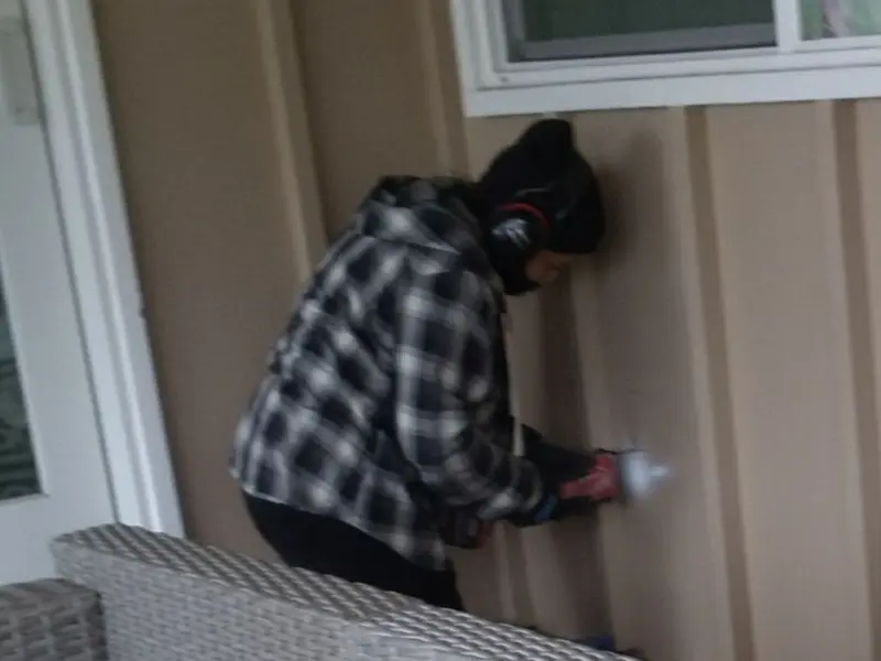 Professional electrician installing an exterior outlet in Linthicum