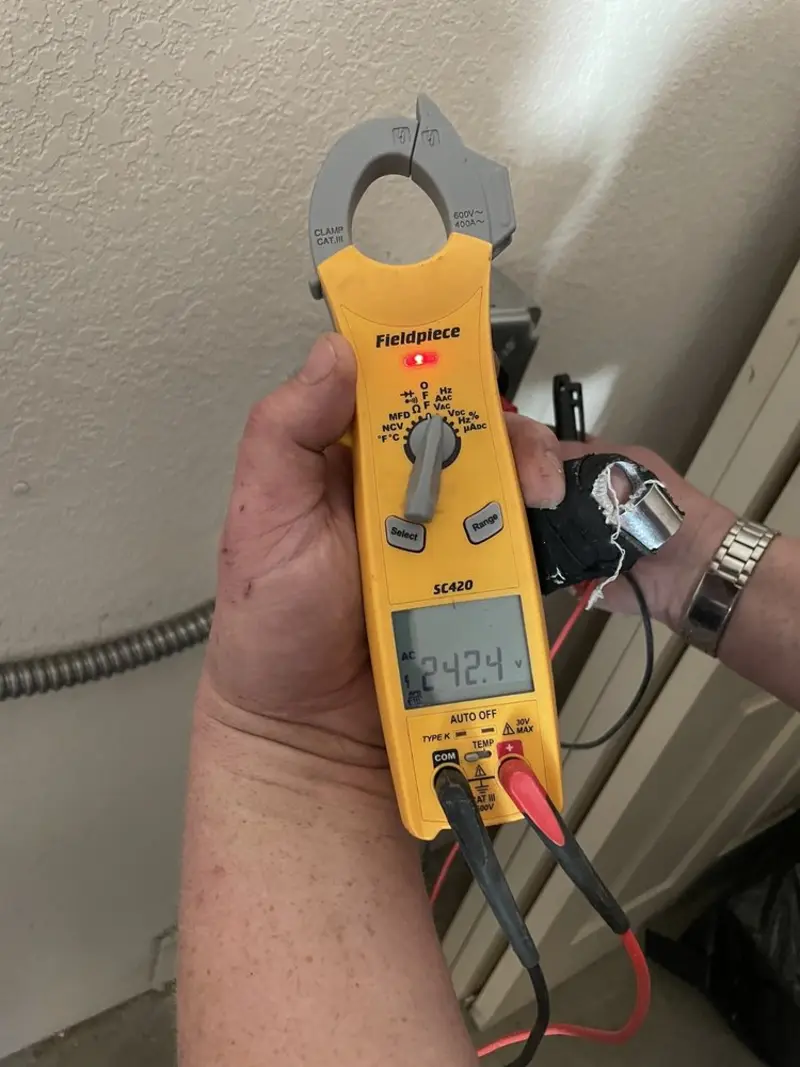 Voltage testing with clamp meter during Electrical Installation Services in Linthicum